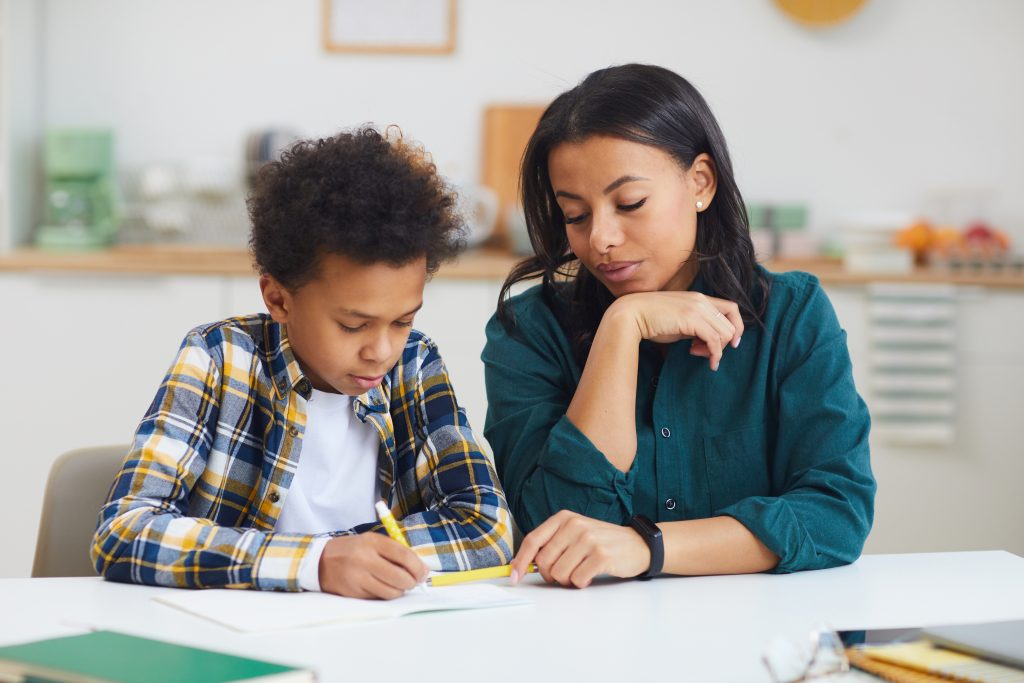 A parent and child reviewing an evaluation report together