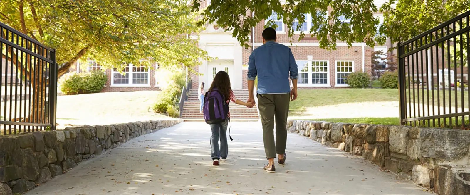 Parent walking child to school